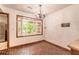 Bright dining area featuring large bay window and brick floors at 712 S Timberlane Dr, New Smyrna Beach, FL 32168