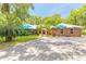 Charming brick home with a well-manicured lawn and inviting front entrance at 712 S Timberlane Dr, New Smyrna Beach, FL 32168
