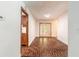 Inviting foyer featuring brick floors, leading to a bright, open living space at 712 S Timberlane Dr, New Smyrna Beach, FL 32168