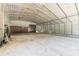 Large metal outbuilding with concrete floor, providing ample storage and workspace at 712 S Timberlane Dr, New Smyrna Beach, FL 32168