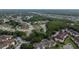 This aerial image displays a large residential community with ponds, natural barriers, and access to highways in the distance at 723 Oakwater Ln, Port Orange, FL 32128
