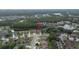 An aerial view shows a residential community surrounding a pond with an arrow indicating the location of the featured property at 723 Oakwater Ln, Port Orange, FL 32128