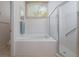Bathroom featuring a large soaking tub and separate glass enclosed shower at 723 Oakwater Ln, Port Orange, FL 32128