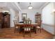 Formal dining room featuring hardwood floors and a large wooden table at 723 Oakwater Ln, Port Orange, FL 32128