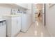 Convenient laundry room with sink, washer, and dryer at 723 Oakwater Ln, Port Orange, FL 32128
