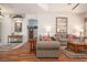 Spacious living room with wood floors, comfortable seating, decor accents, and an open layout at 723 Oakwater Ln, Port Orange, FL 32128