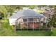 Aerial view of covered patio with outdoor seating and manicured landscaping offering a relaxing outdoor experience at 723 Oakwater Ln, Port Orange, FL 32128