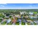 This aerial view of the neighborhood shows the homes, landscaping, and nearby lake at 809 Brightview Dr, Lake Mary, FL 32746