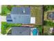 Aerial view of the home's roof, backyard, patio, and neighboring houses with a pool at 809 Brightview Dr, Lake Mary, FL 32746