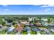 Aerial view of the neighborhood showcases a lake and the surrounding greenery and homes at 809 Brightview Dr, Lake Mary, FL 32746