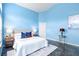 Relaxing bedroom featuring blue walls, modern flooring, and ample natural light at 809 Brightview Dr, Lake Mary, FL 32746