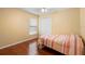 Bedroom with a double bed, wood flooring, ceiling fan and ample natural light at 809 Brightview Dr, Lake Mary, FL 32746