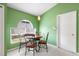 Charming eat-in kitchen with round table, decorative lighting, and sunny window at 809 Brightview Dr, Lake Mary, FL 32746