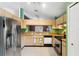 Well-lit kitchen with stainless steel appliances, modern cabinetry, and breakfast bar at 809 Brightview Dr, Lake Mary, FL 32746