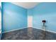 Bright living room with blue walls, dark tile floor, and a classic lamp on a side table at 809 Brightview Dr, Lake Mary, FL 32746