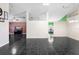 Open living room layout featuring modern black tile flooring and views of other rooms at 809 Brightview Dr, Lake Mary, FL 32746
