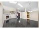 Spacious living room with a fireplace, black tile floors, and an open layout at 809 Brightview Dr, Lake Mary, FL 32746
