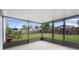 View of the home's outdoor screened patio featuring a concrete floor, and backyard view at 809 Brightview Dr, Lake Mary, FL 32746