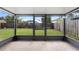 This screened patio features concrete floors, a door to the backyard, and provides outdoor living at 809 Brightview Dr, Lake Mary, FL 32746