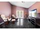 Cozy sitting room features French doors, comfortable seating and a television at 809 Brightview Dr, Lake Mary, FL 32746