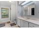 Bright bathroom features a window over the toilet, a shower, and wood-look flooring at 901 Vicksburg St, Deltona, FL 32725