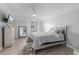 Comfortable bedroom with neutral colors, wood-look flooring, and modern ceiling fan at 901 Vicksburg St, Deltona, FL 32725
