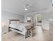 Relaxing bedroom boasts soft, neutral tones, wood-look flooring, and natural light at 901 Vicksburg St, Deltona, FL 32725