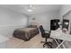 Inviting bedroom with a desk, closet, neutral colors, and natural light at 901 Vicksburg St, Deltona, FL 32725