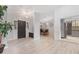 Bright entryway with updated flooring, stylish lighting, and open access to kitchen and dining spaces at 901 Vicksburg St, Deltona, FL 32725