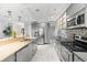 Modern kitchen with stainless steel appliances, sleek countertops, and ample cabinet space at 901 Vicksburg St, Deltona, FL 32725