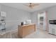 Bright office space features a ceiling fan, natural light, and a large desk with computer setup at 901 Vicksburg St, Deltona, FL 32725