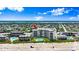 Enjoy beachfront living with these lovely condos, with sparkling pools, and easy beach access in this captivating aerial view at 915 Ocean Shore Blvd # 8010, Ormond Beach, FL 32176