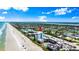 Aerial view showcases a beachfront condo with an arrow, highlighting its prime location and coastal charm at 915 Ocean Shore Blvd # 8010, Ormond Beach, FL 32176