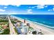 Stunning aerial view of a condo building near the ocean with an arrow, offering beach access and scenic surroundings at 915 Ocean Shore Blvd # 8010, Ormond Beach, FL 32176