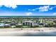 Coastal living at its finest with beachfront condos, sparkling pools, and manicured lawns in this stunning aerial view at 915 Ocean Shore Blvd # 8010, Ormond Beach, FL 32176
