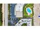 Unique aerial perspective of beachfront property with parking and a unique view of a community swimming pool at 915 Ocean Shore Blvd # 8010, Ormond Beach, FL 32176