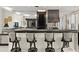 Stylish bar area features padded stools and serving counter with storage space at 915 Ocean Shore Blvd # 8010, Ormond Beach, FL 32176