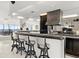 Open bar area features modern stools and bar top with custom range hood at 915 Ocean Shore Blvd # 8010, Ormond Beach, FL 32176