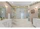 Bathroom featuring a tub and shower combination with gold trim at 915 Ocean Shore Blvd # 8010, Ormond Beach, FL 32176