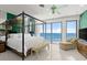 Bedroom featuring a wall of windows and an ocean view at 915 Ocean Shore Blvd # 8010, Ormond Beach, FL 32176