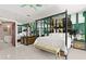 Bedroom featuring view of the ocean, tiled floors, and a four-poster bed at 915 Ocean Shore Blvd # 8010, Ormond Beach, FL 32176