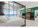 Bedroom featuring a wall of windows and an ocean view at 915 Ocean Shore Blvd # 8010, Ormond Beach, FL 32176