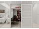 Bedroom walk-in closet space with ample built in shelving and a workstation desk at 915 Ocean Shore Blvd # 8010, Ormond Beach, FL 32176