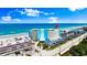 Exterior shot of a modern condo building on a sunny day, showcasing its coastal location and beachside views at 915 Ocean Shore Blvd # 8010, Ormond Beach, FL 32176
