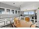 Bright kitchen with custom cabinets, modern appliances, and a breakfast table overlooking a view at 915 Ocean Shore Blvd # 8010, Ormond Beach, FL 32176