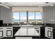Spacious kitchen featuring black appliances, an island, and an expansive view of the ocean at 915 Ocean Shore Blvd # 8010, Ormond Beach, FL 32176