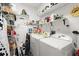 Organized laundry room with shelving and modern washer and dryer at 915 Ocean Shore Blvd # 8010, Ormond Beach, FL 32176