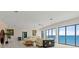 Bright living room with wall-to-wall windows with views of the Atlantic Ocean at 915 Ocean Shore Blvd # 8010, Ormond Beach, FL 32176