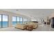 Expansive living room with floor-to-ceiling windows offering amazing ocean views at 915 Ocean Shore Blvd # 8010, Ormond Beach, FL 32176