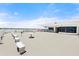 Wide rooftop deck with patio furniture and panoramic views of the city skyline at 915 Ocean Shore Blvd # 8010, Ormond Beach, FL 32176